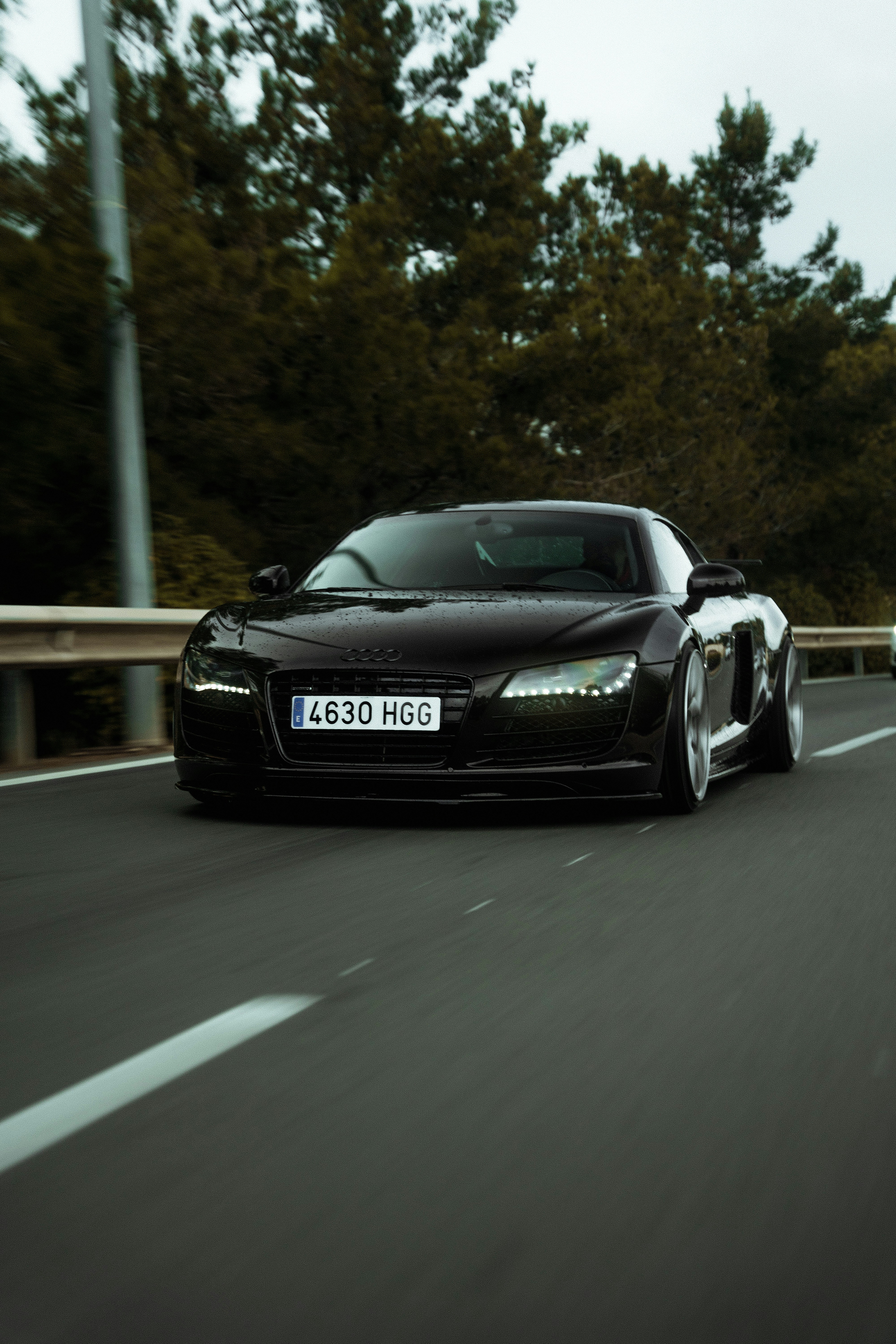 Black supercar driving on a highway